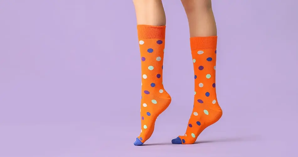 Orange Compressions Socks With White And Blue Polka Dots