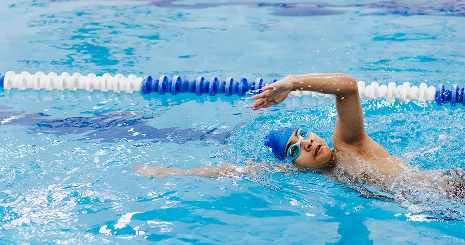 A Person Swimming Crawl In A Swimming Pool A Person Swimming Crawl In A Swimming Pool