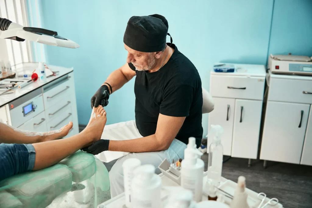 A Man Giving A Pedicure