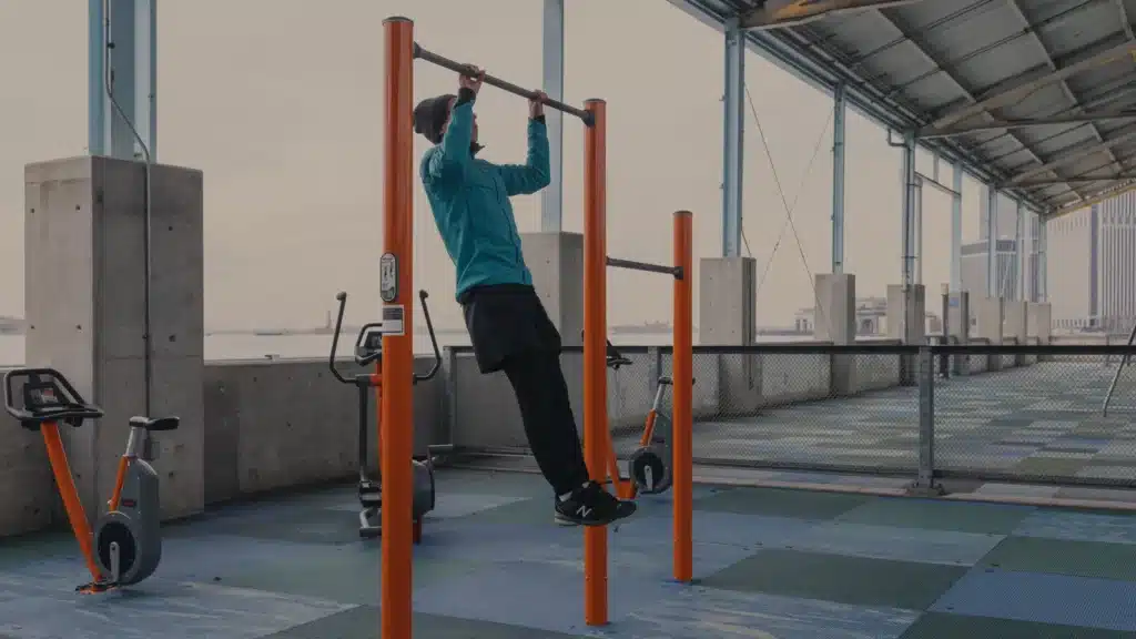 A Person Doing Pull Ups On A Bar