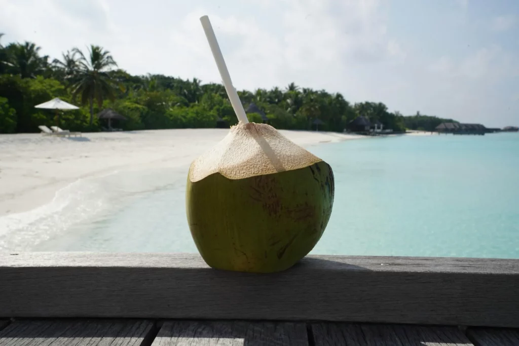Image1 11Zon 36 A Coconut With A Straw On A Wood Surface
