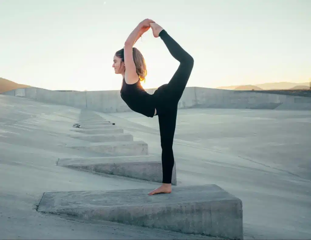 A Woman Doing Yoga On A Concrete Block