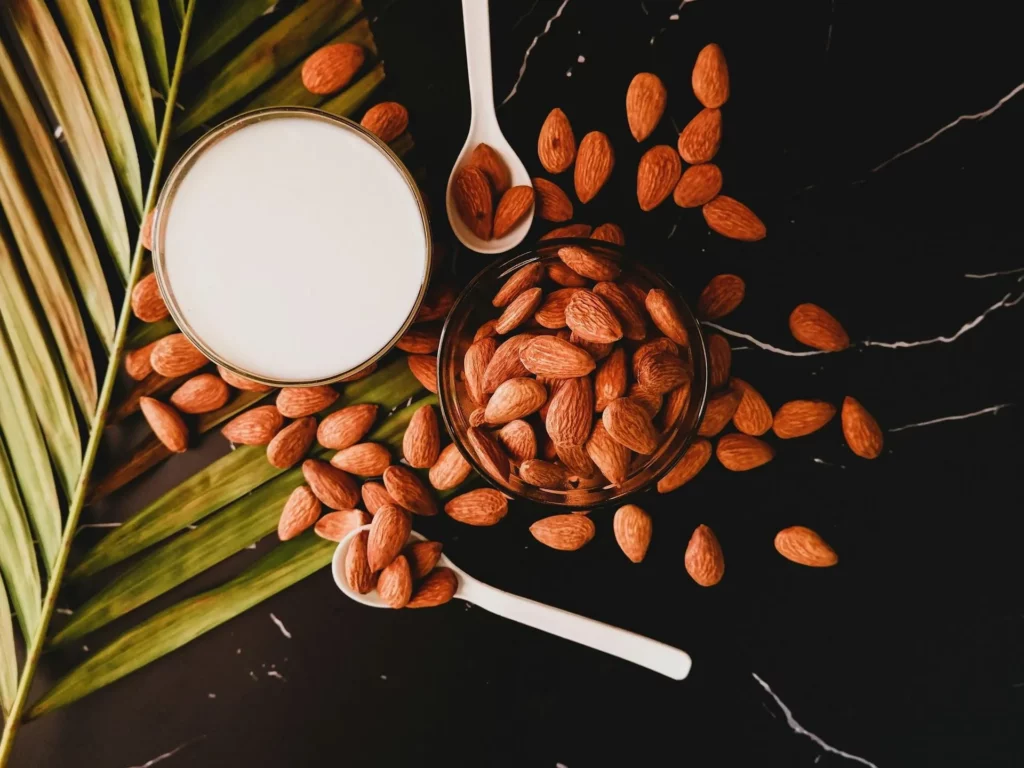 Image4 11Zon 38 A Glass Of Milk And Almonds On A Black Surface