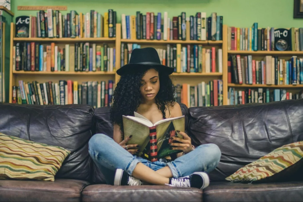 Image4 11Zon 5 A Woman Sitting On A Couch Reading A Book