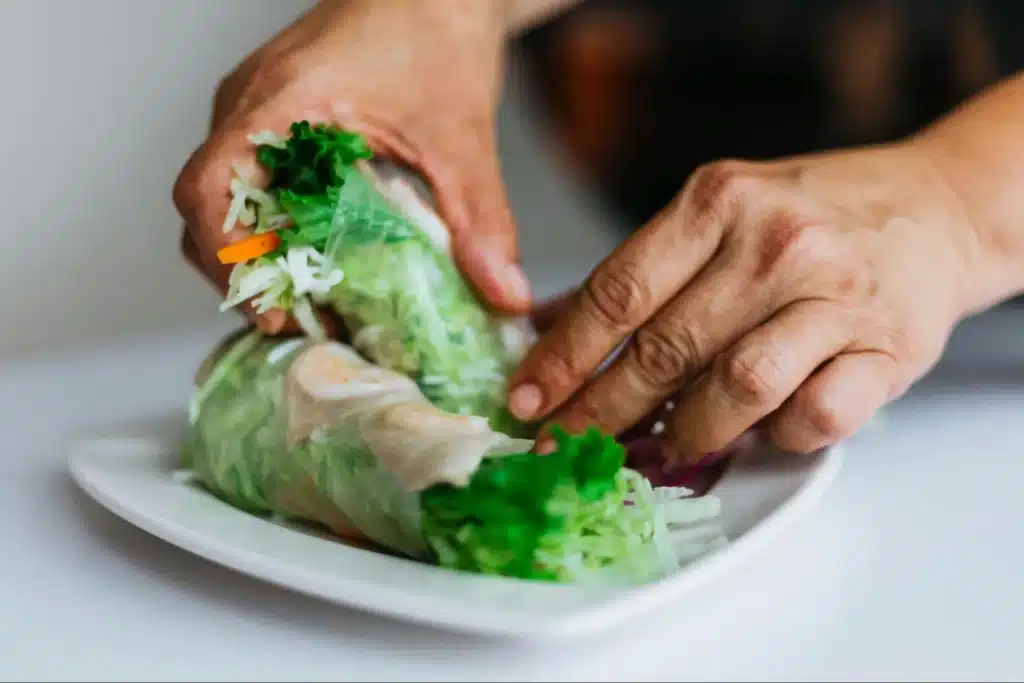Image5 11Zon A Person'S Hands Holding A Chicken Wrap