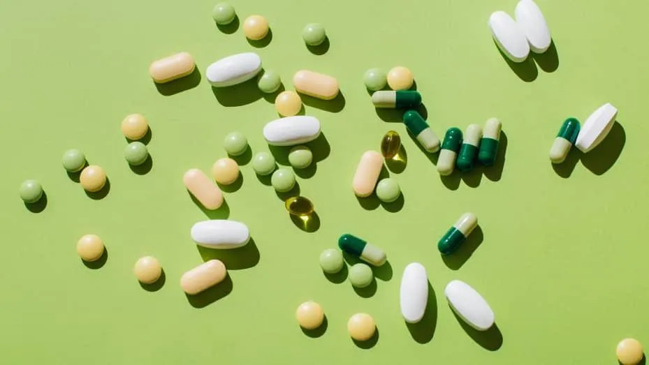 Image5 11Zon 14 A Group Of Pills Of Probiotics On A Green Surface