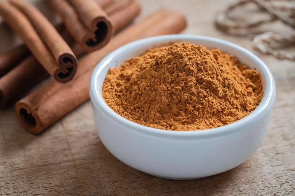 Image6 11Zon 12 A Bowl Of Cinnamon In Front Of Cinnamon Sticks