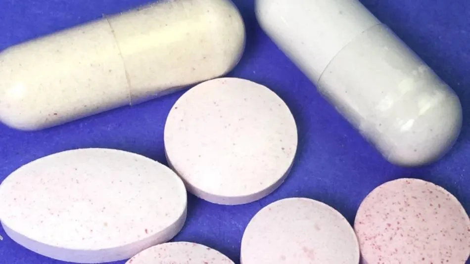 Image7 11Zon 12 A Group Of Pills On A Blue Surface